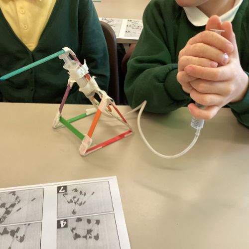 In Year5/6 we have been busy exploring pneumatic systems. We created a working pneumatic system using only 4 pieces of equipment: tubing, syringes, lolly sticks and tape.